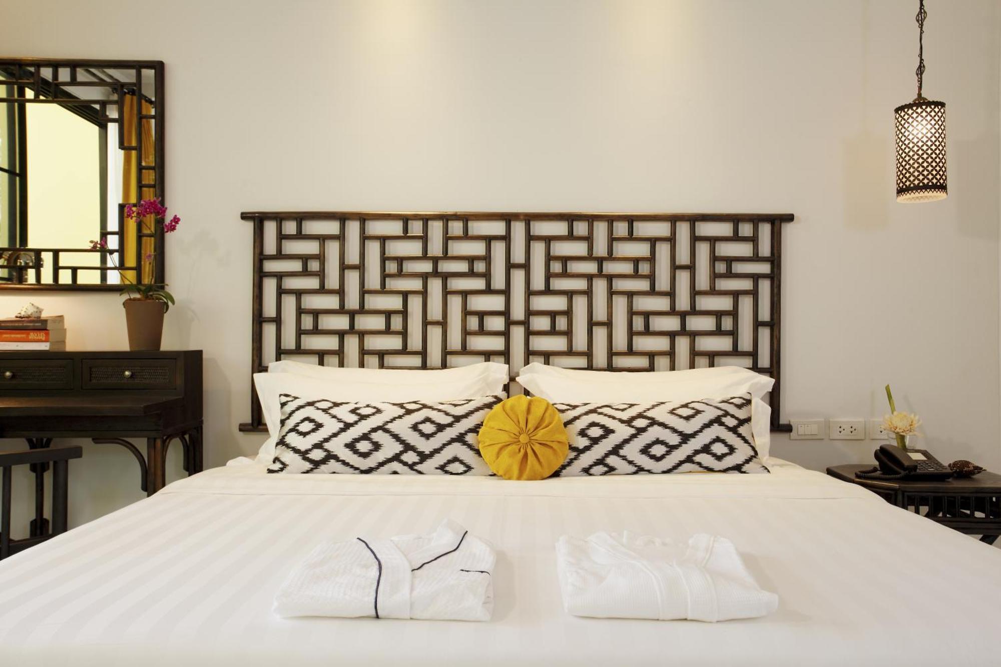 Moracea By Khao Lak Resort Room photo A bed with a headboard